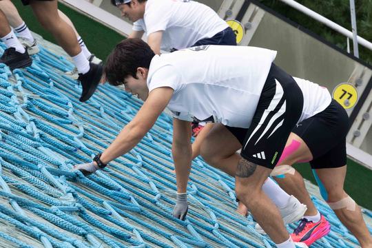 Runners climbing the ski jump at Red Bull 400